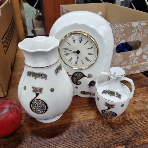 707 - A box containing three  pieces of Irish made Tara pottery including a mantle clock and vase.