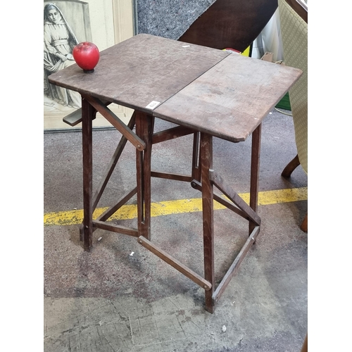 719 - A rather handsome antique fold out table. Looks to be greatly over engineered and love the look, wou... 