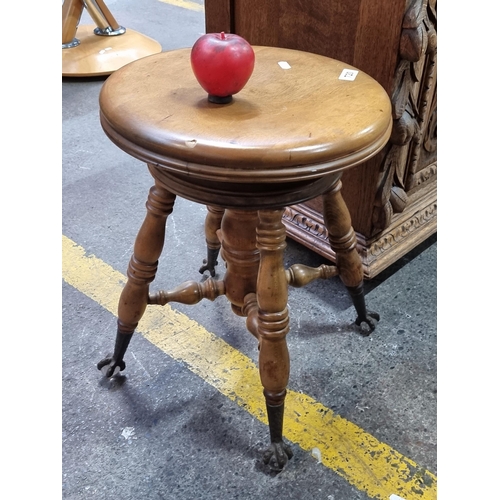 720 - Star Lot : A superb antique Tonk style stool featuring crows talons holding glass ball feet. Present... 