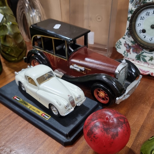 735 - Two large scale model cars including a Jaguar XK 120 coupe (1948) in its original display case and a... 