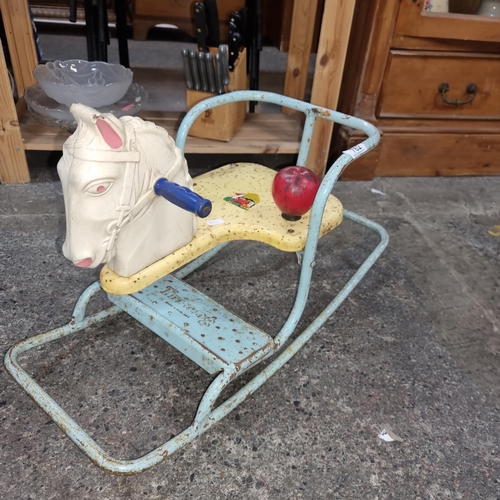 762 - A whimsical C.1960's Tri-ang metal frame rocking horse.