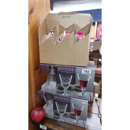 763 - Three boxes each containing six drinking glasses including two boxes of bohemia crystal glasses. All... 