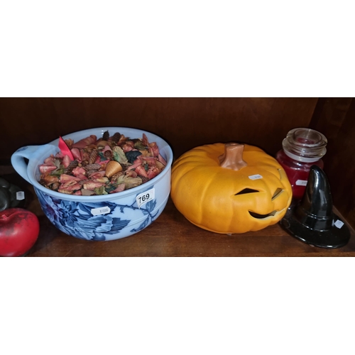 769 - Four items including a large ceramic pumpkin and a large Yankee Christmas candle and a handsome blue... 