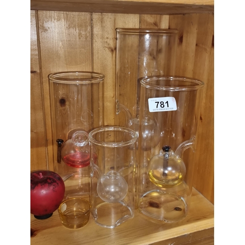 781 - Four vintage handblown Wolfard oil lamps in various sizes. Contained different colour oil for a very... 