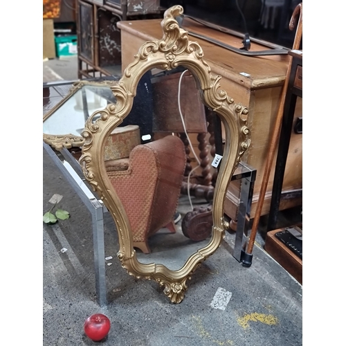 784 - A gorgeous highly ornate rococo style wall mirror. Lovely interesting shape