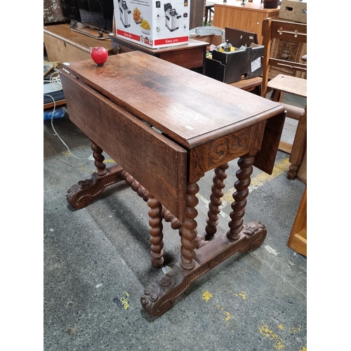 787 - Star Lot : A stunning large antique 19th century  oak dropleaf table featuring barley twist columns ... 