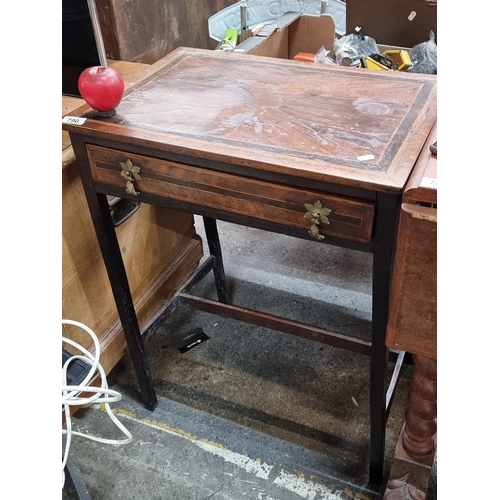 790 - A rather handsome early 20th century side table featuring pullout drawer brass hardware and string i... 