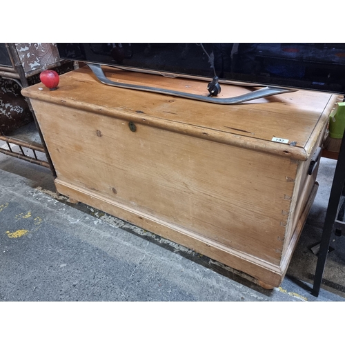 792 - Star Lot : A stunning large antique  pine storage trunk featuring metal handles, set on bun feet wit... 