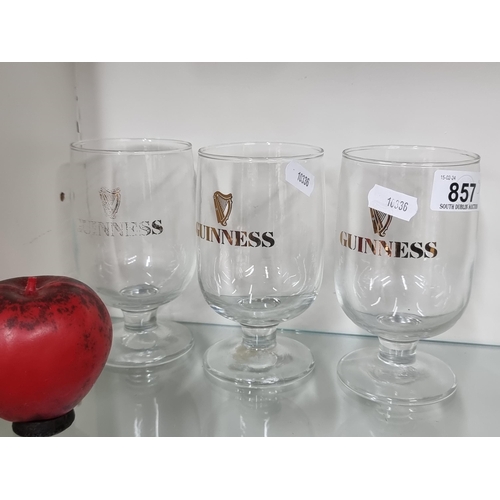 857 - Three authentic vintage half pint Guinness glasses.