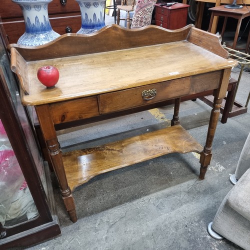 751 - Star Lot : A beautifully made antique Elm  washstand featuring one pullout drawer with brass handle,... 