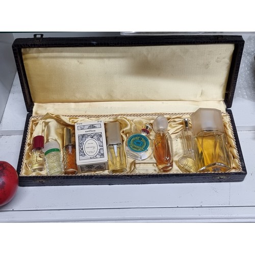 871 - A stunning selection of ten retro perfumes including O de lancome and Estee Lauder examples housed i... 