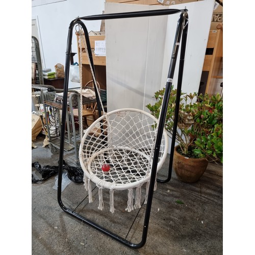 838 - Star Lot: A superb hanging swing chair with stylish macrame seat suspended on a metal frame. Perfect... 