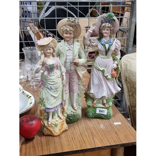 841 - Three vintage large German bisque figures including two elegant young ladies and a finely dressed yo... 