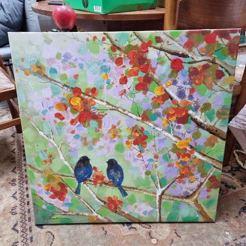 851 - A good sized hand embellished print on canvas featuring two love birds perched on a blossoming tree ... 