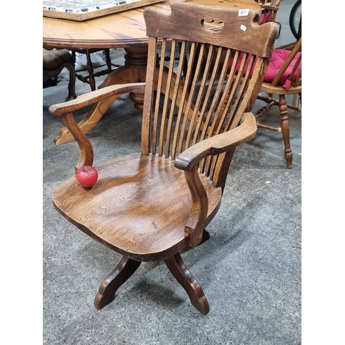 977 - Star Lot : A fabulous antique revolving oak captain's chair, with a charming patina, inviting rich h... 