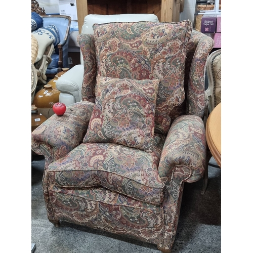 978 - A Lovey vintage overstuffed  wingback armchair upholstered in William Morris style fabric, showcasin... 