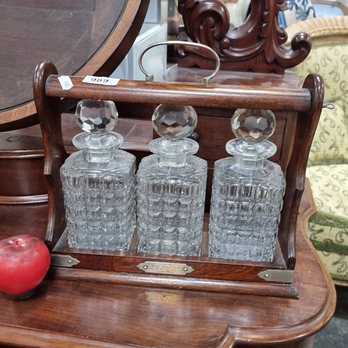 989 - Star lot : A lovely antique Edwardian Tantalus decanter set with rich mahogany stand, exuding timele... 