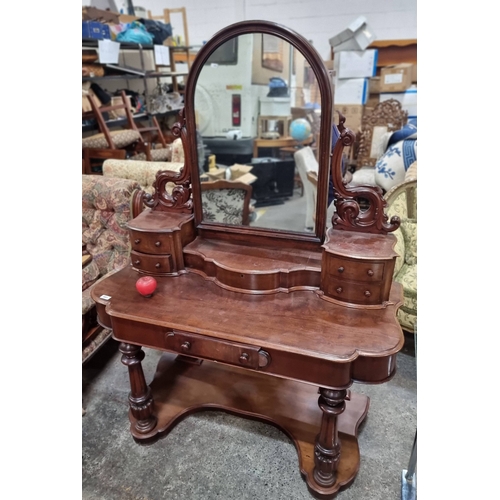 991 - Star Lot : An Ornate antique mahogany Sit in Dressing table  featuring a swivel mirror and intricate... 