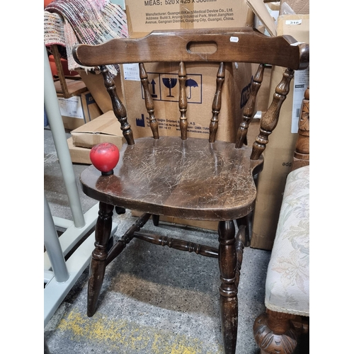 996 - Vintage wooden captain's chair, featuring an aged patina and sturdy turnings, exudes period charm an... 