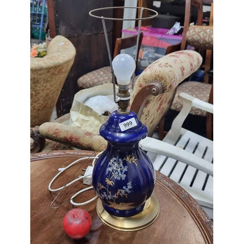 999 - Ornate cobalt blue table lamp with delicate gilded floral motifs, evoking a touch of oriental elegan... 