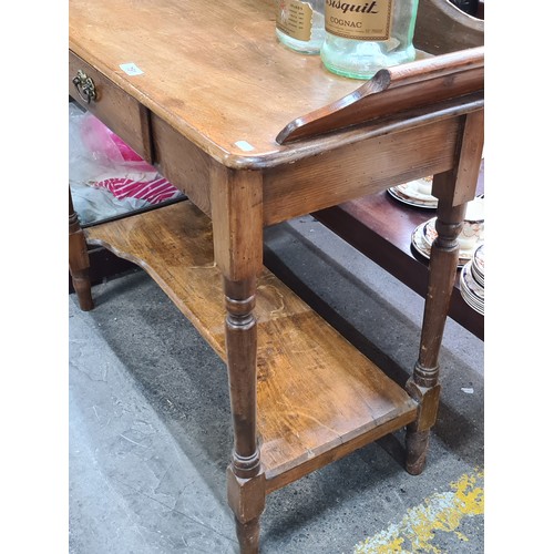 751 - Star Lot : A beautifully made antique Elm  washstand featuring one pullout drawer with brass handle,... 