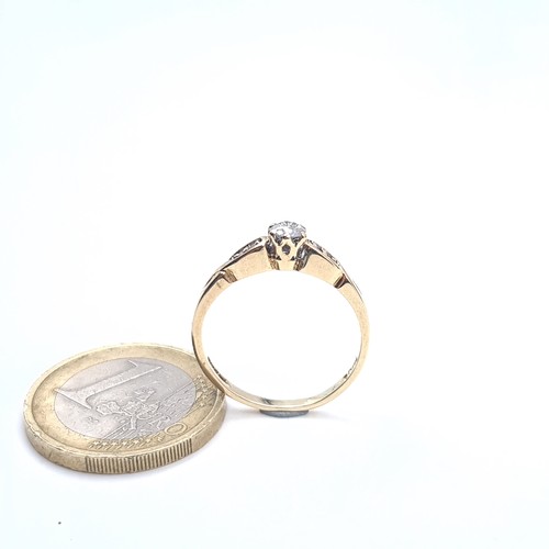 501 - Star Lot : A very pretty 9K gold diamond ring with twist set mount, size O, weight 2 grams, boxed.