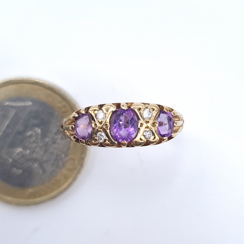 503 - Star Lot : An attractive amethyst and diamond stone vintage ring, size Q, weight 1.94 grams, boxed.