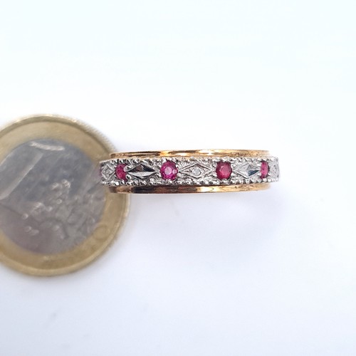 504 - Star Lot : A 9K gold diamond and ruby full eternity ring, size R, weight 3.02 grams, boxed.