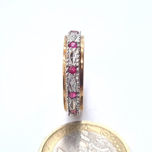 504 - Star Lot : A 9K gold diamond and ruby full eternity ring, size R, weight 3.02 grams, boxed.