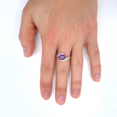 506 - Star Lot : A 9K gold amethyst stone ring set with diamond twist set mount, size T, weight 2.6 grams,... 