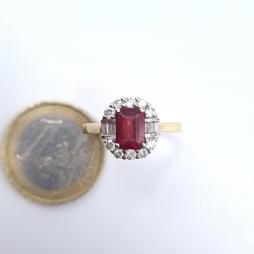 521 - A 9K gold garnet stone ring with gem stone surround, size P, weight 2.9 grams, boxed.