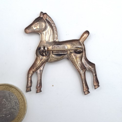 535 - A sterling silver brooch in the form of a foal, 4cmx3.5cm.