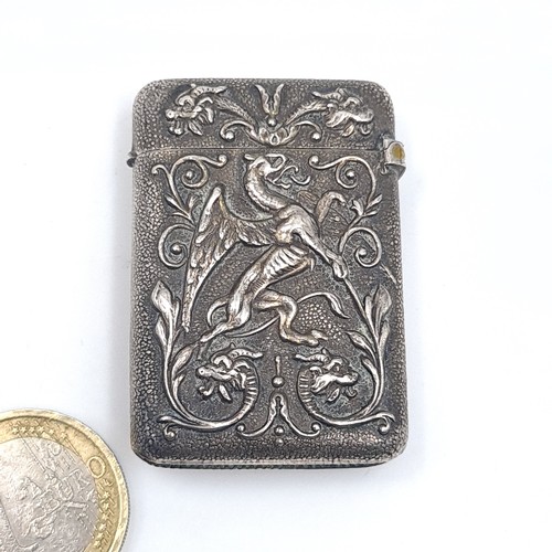 540 - A sterling silver vesta case hallmarked London with profusely decorated, hallmarked London, marks in... 