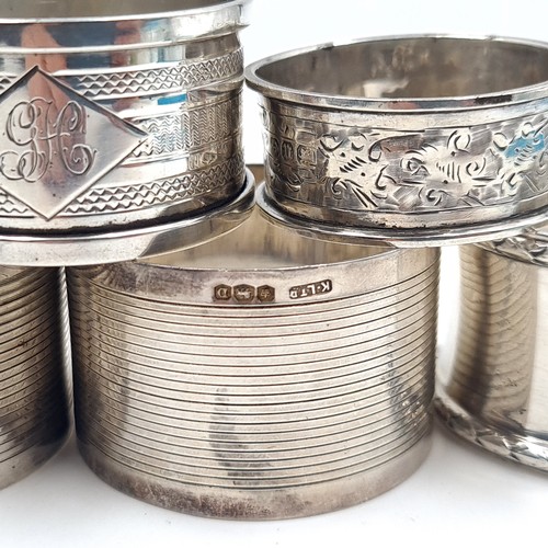 543 - A collection of five sterling silver napkin rings with various hallmarks total weight 89 grams.