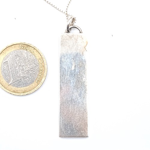 548 - A sterling silver ingot hallmarked Birmingham with sterling silver chain, length 44cm, weight 17.84 ... 