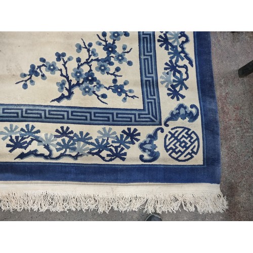 993 - Star Lot: A marvelous thick pile hand knotted woolen rug in a breathtaking blue and white Chinese pa... 