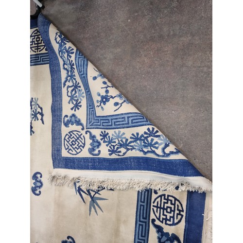 993 - Star Lot: A marvelous thick pile hand knotted woolen rug in a breathtaking blue and white Chinese pa... 