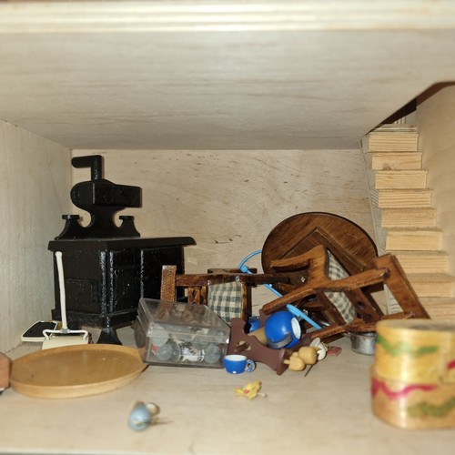 221 - A beautifully handcrafted full dolls house containing an adorable, large quantity of furniture and h... 