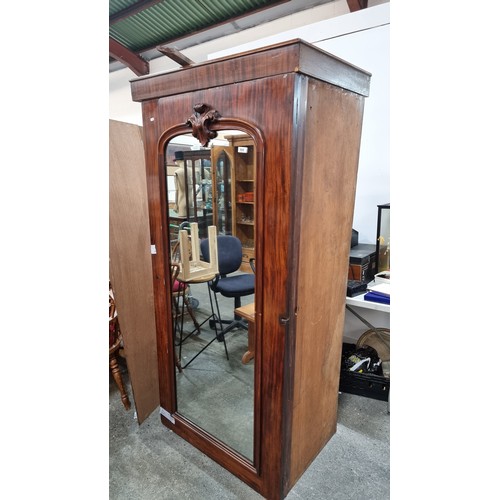 968 - Elegant Victorian  mahogany-framed Wardrobe with mirrored door with florid crest detail, reflecting ... 