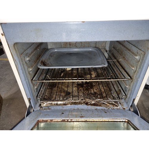 1001 - STAR LOT : A 1972  white vintage electric range, chrome accents, complete with analog controls, a un... 