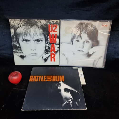 135 - Three fantastic vintage U2 vinyl albums including War, Boy, and The Rattle and Hum.