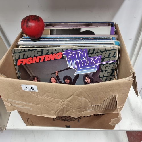 136 - A very good box containing a large collection of vinyl records including artists such as Thin Lizzy ... 