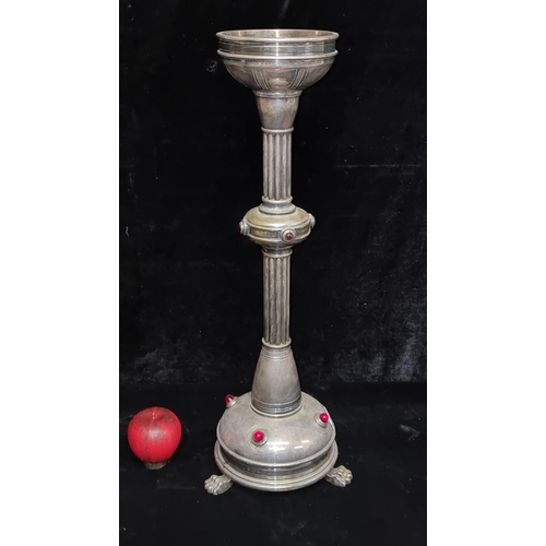 214 - A stunning Art Nouveau candle holder featuring claw feet, reeded stem, red gemstones and marked Dubl... 