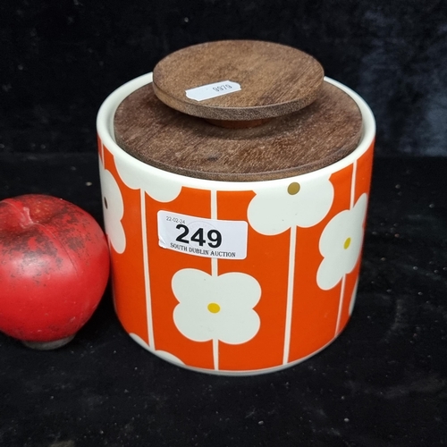 249 - A gorgeous Orla Kiely cookie jar with stunning vibrant orange flower pattern with wooden lid.