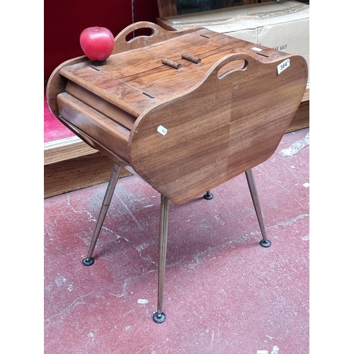 384 - A fab 1960's Mid Century sewing box with pull out hinged drawers to rosewood lid and tapered metal l... 