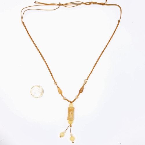 568 - A power and authority Ru Yi Stick necklace. Length 42 cms. Stones cold to the touch.