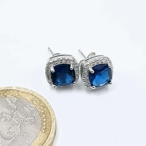 582 - A super pair of blue stone cushion cut stud earrings with Moissonite stone surround. Old new stock.