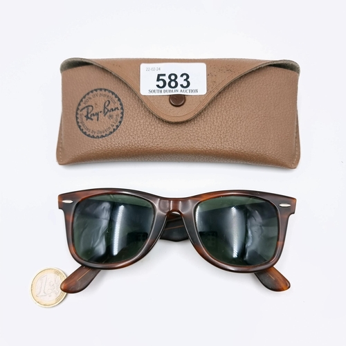 583 - A pair of wayfarer RayBan sunglasses in unused condition with case.