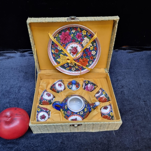 969 - A charming vintage miniature tea set including six cups, teapot and sandwich plate. All decorated in... 