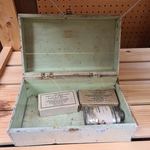 407 - An early 20th century probably WW1 military first aid box containing wound dressing and sterilizer.